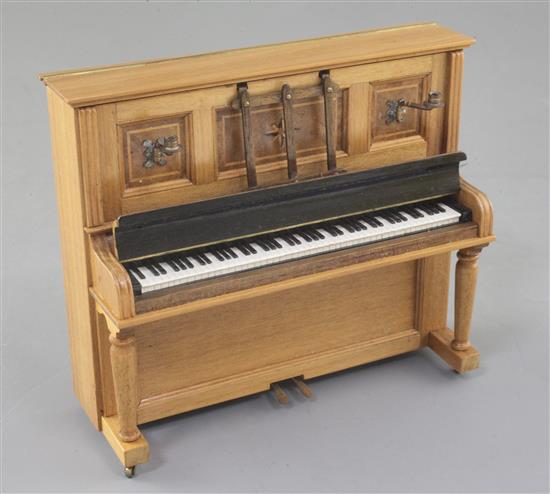 Denis Hillman. A Victorian style walnut miniature upright piano, width 5in.